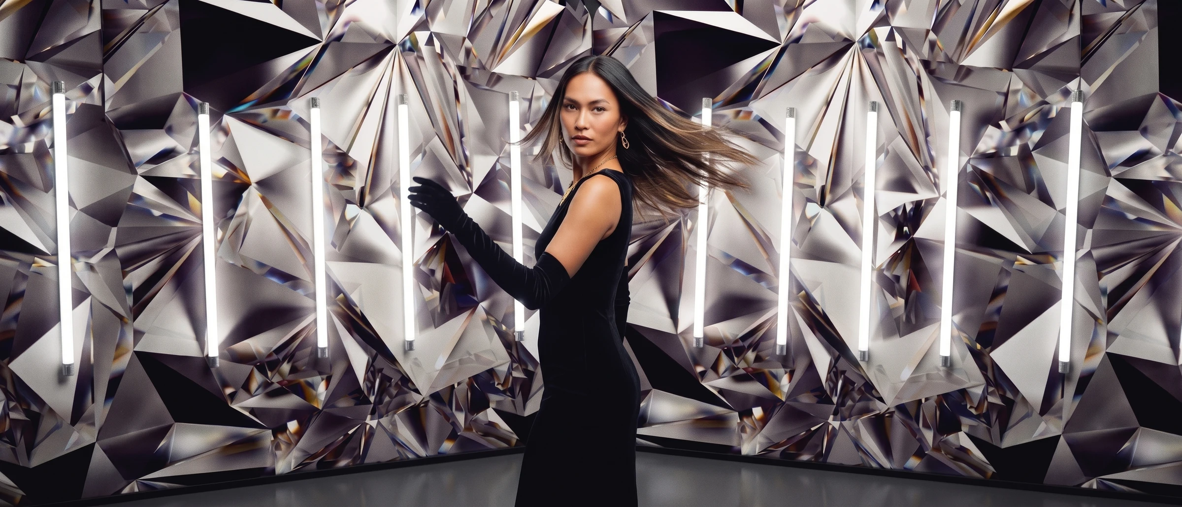 Dazzle Booth — a red-carpet slow-motion glamour moment under studio lighting.